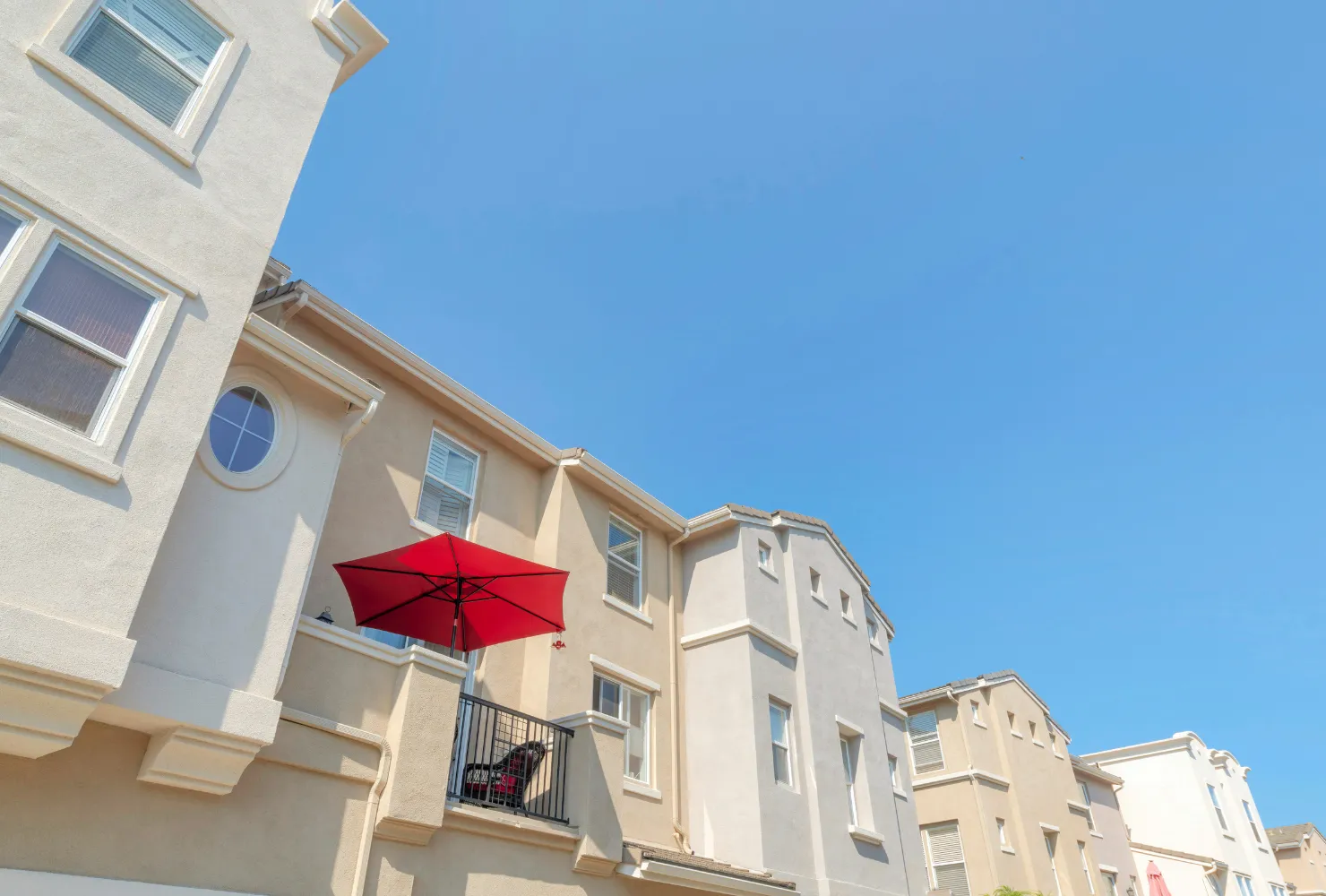 HOA exterior painting project featuring freshly painted condo buildings with balconies