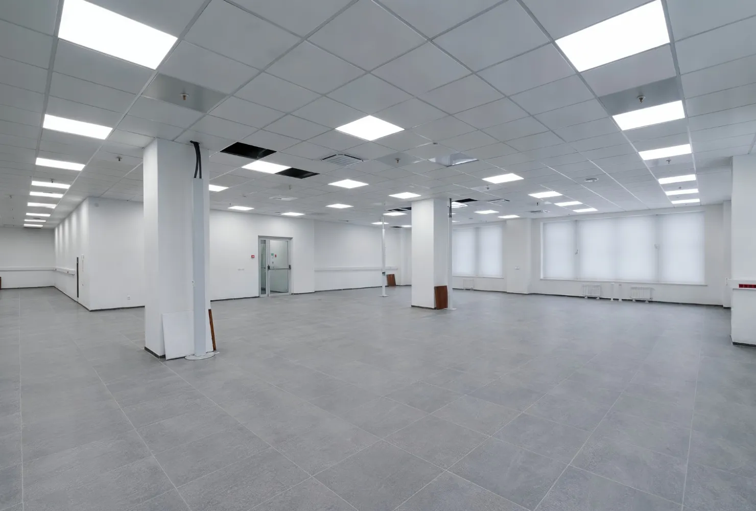 Completed commercial interior painting project in a modern office building with freshly painted walls and ceilings