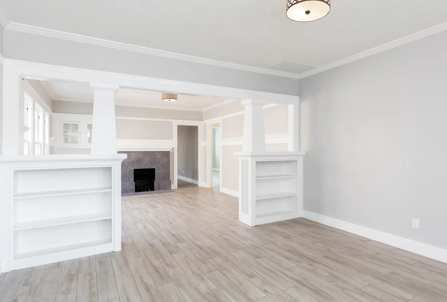 Professional residential interior painting project showing freshly painted walls, trim, and ceilings throughout the home