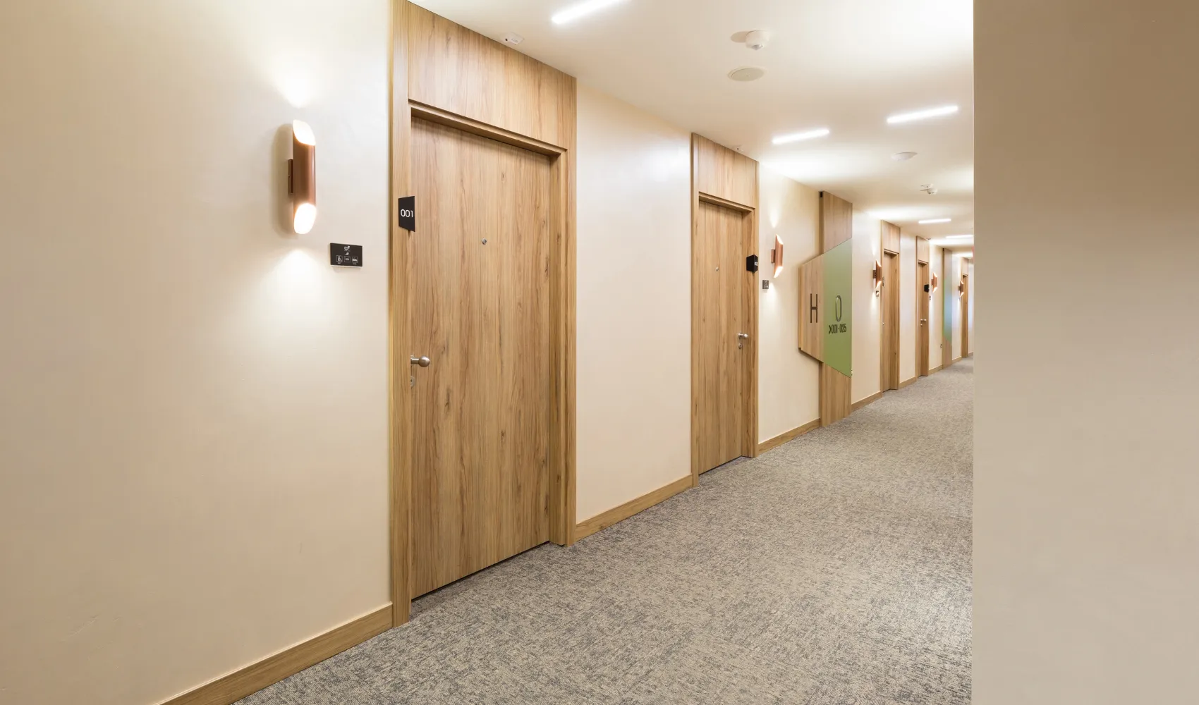 HOA interior hallway painting services with clean finishes and modern lighting in Los Angeles, CA